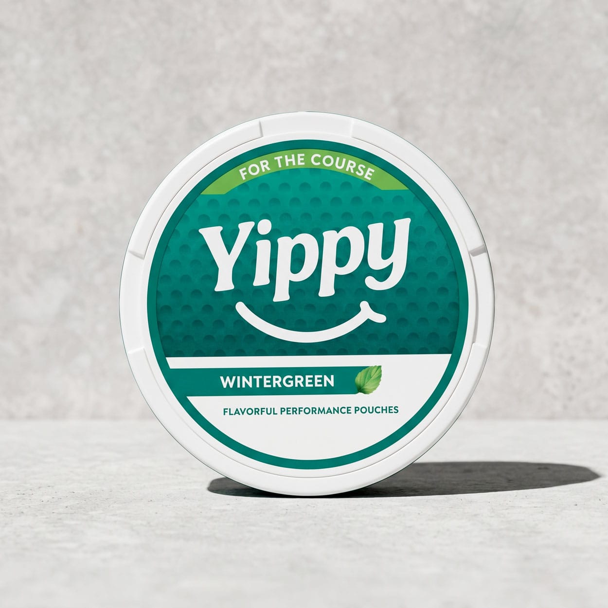 Yippy For The Course Wintergreen tin on a putting green